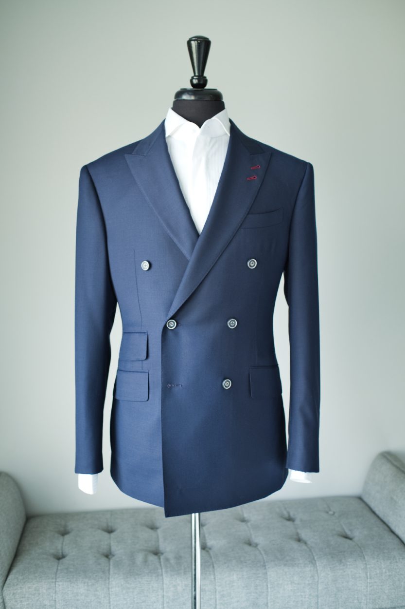 Navy double breasted jacket on a dress form