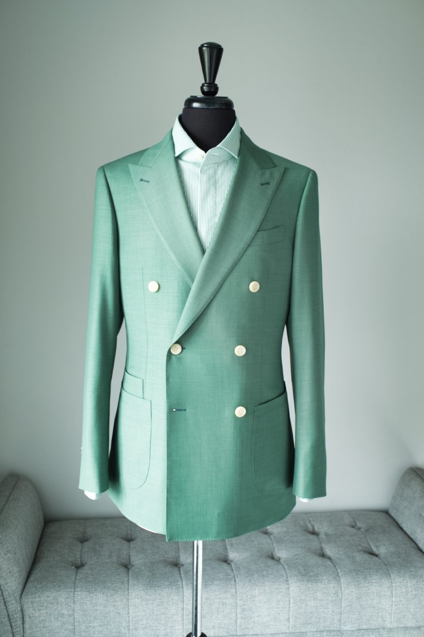 Sage green double breasted jacket on a dress form